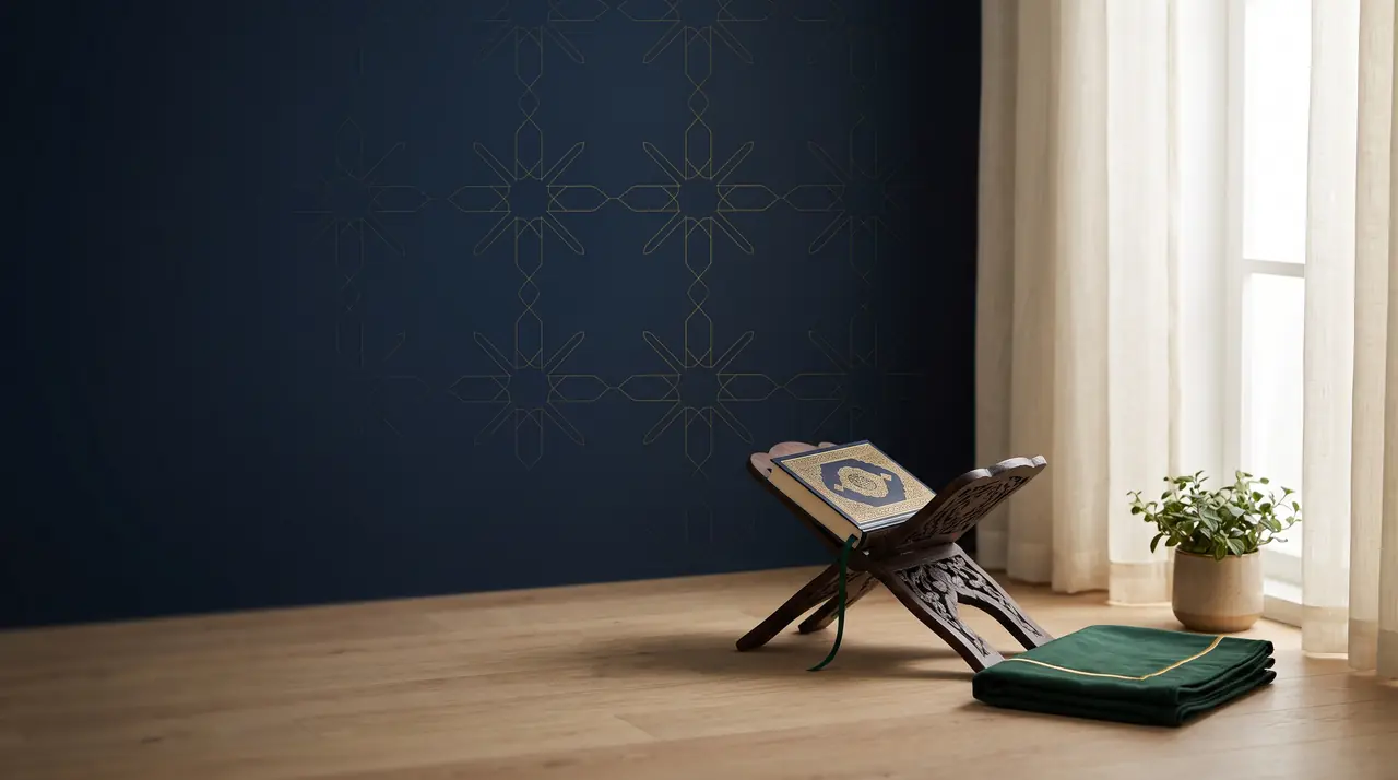 Calm study corner with a carved wooden Quran stand, a green prayer mat and a window with sheer curtains
